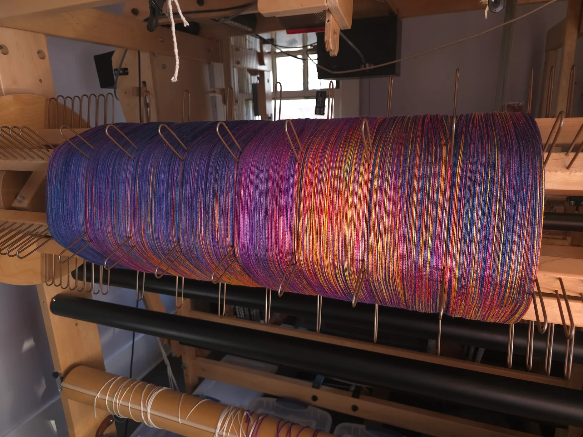 Hand-dyed warp on the loom
